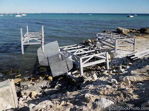 Image of Iron structures on the shore.