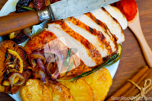 Image of roasted grilled BBQ chicken breast with herbs and spices