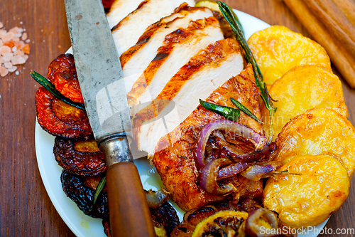 Image of roasted grilled BBQ chicken breast with herbs and spices