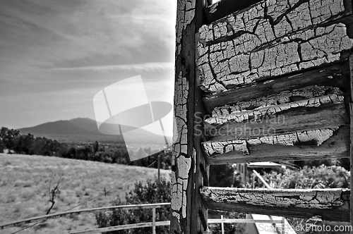 Image of peeling shutter distant city view