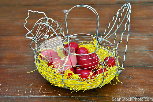 Image of red easter eggs chicken basket