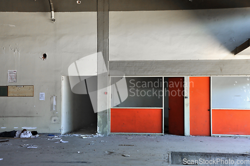 Image of immigrant sleeping in abandoned factory