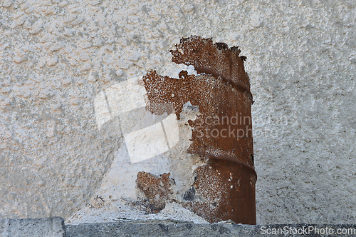 Image of marble dust powder and rusty barrel