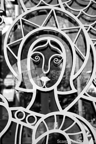 Image of saint on metal church door
