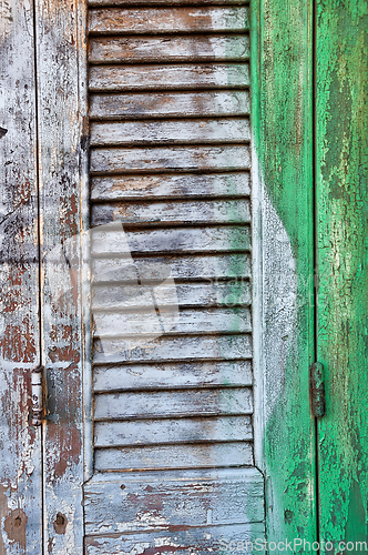 Image of window shutter with paint background