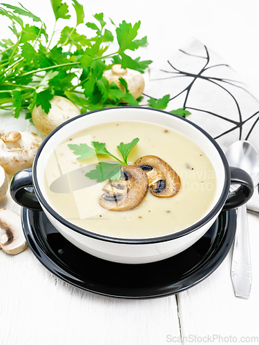 Image of Soup puree of champignon in bowl on light board