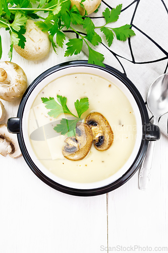 Image of Soup puree of champignon in bowl on table top