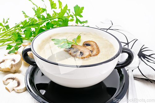 Image of Soup puree of champignon in bowl on white board