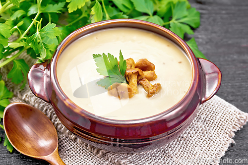 Image of Soup puree of chanterelle in bowl on black board