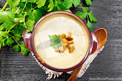 Image of Soup puree of chanterelle in bowl on board top