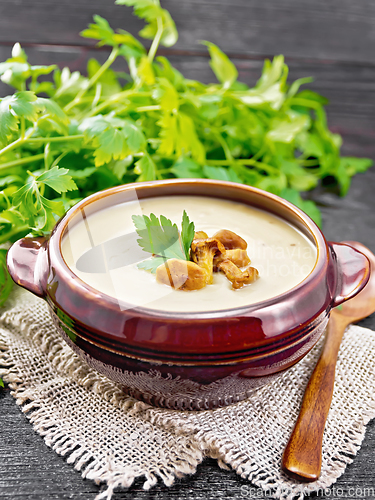 Image of Soup puree of chanterelle in bowl on napkin