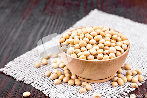 Image of Soybeans in wooden bowl on board