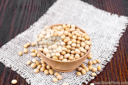 Image of Soybeans in wooden bowl on dark board