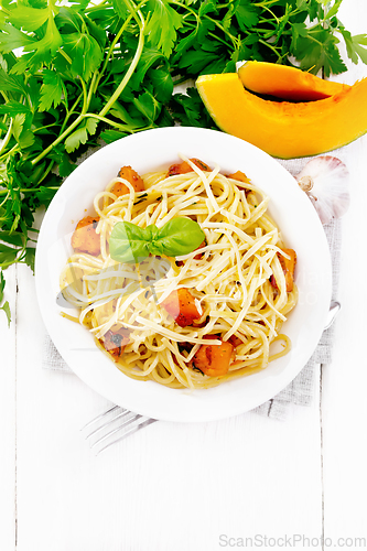 Image of Spaghetti with pumpkin in plate on light board top