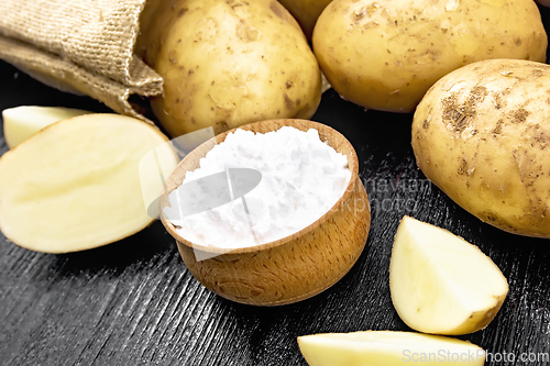 Image of Starch potato in bowl on black board