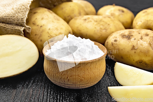 Image of Starch potato in bowl on dark board