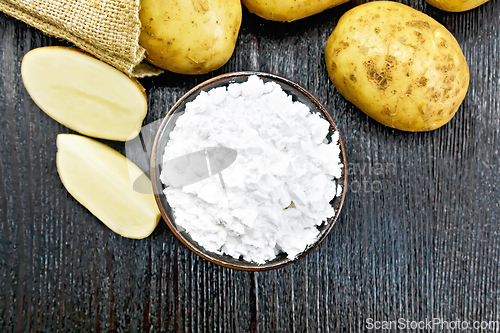 Image of Starch potato in clay bowl on board top