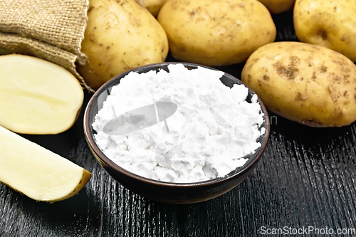 Image of Starch potato in clay bowl on board