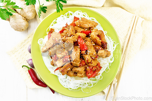 Image of Stir-fry of chicken with peppers in plate on board top