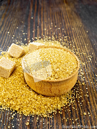 Image of Sugar brown in bowl on dark board