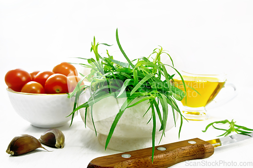 Image of Tarragon in mortar on light board