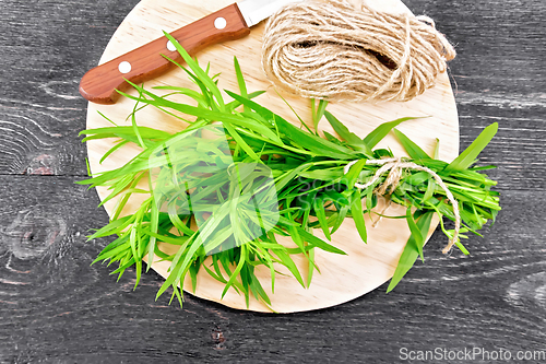 Image of Tarragon with knife on board top