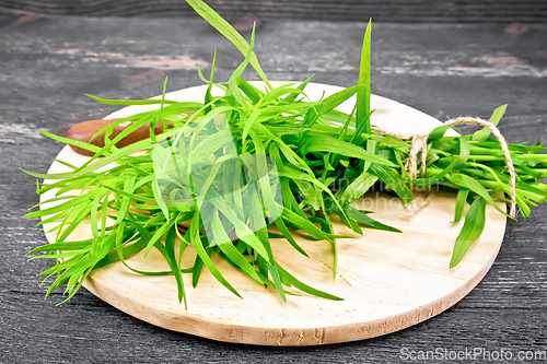 Image of Tarragon with knife on board
