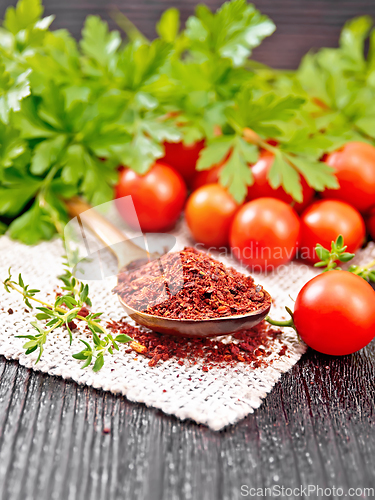 Image of Tomatoes dried in spoon on black board