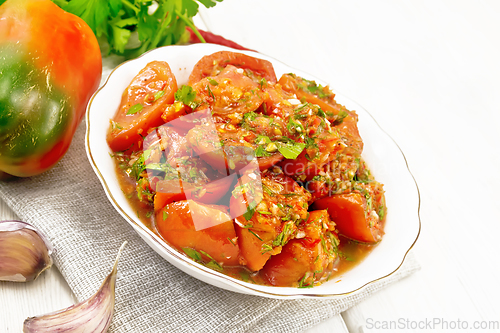 Image of Tomatoes Korean in plate on board