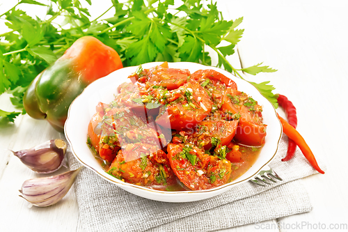 Image of Tomatoes Korean in plate on light board