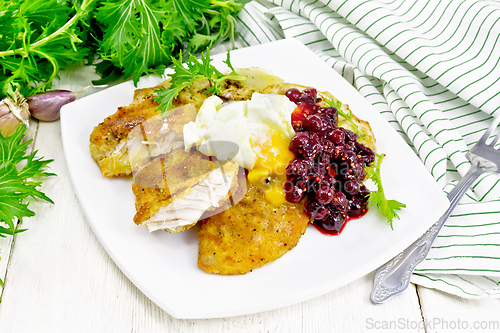 Image of Turkey breast with cranberry sauce on board