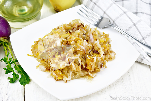 Image of Turnip fried in plate on white wooden board