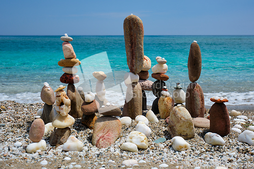 Image of Concept of balance and harmony - pebble stone stacks on the beach