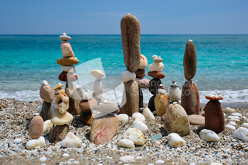 Image of Concept of balance and harmony - pebble stone stacks on the beach