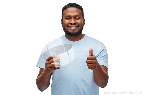 Image of happy african american man with glass of water