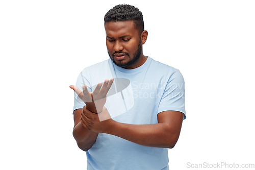 Image of african american man suffering from pain in hand
