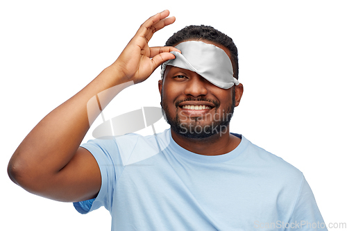 Image of happy african american man with eye sleeping mask