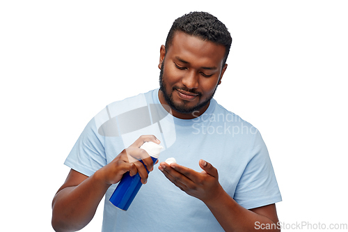 Image of happy african american man with shaving cream