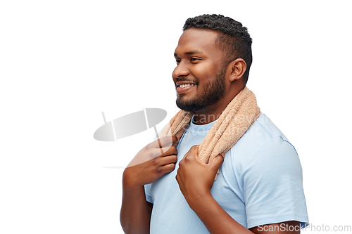 Image of smiling african man with bath towel