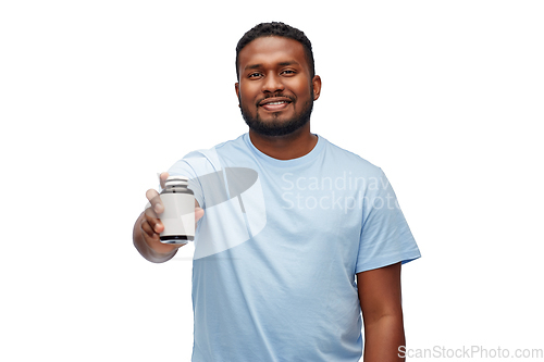 Image of smiling african american man with medicine jar