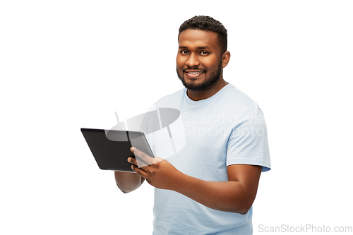 Image of happy african american man with tablet computer