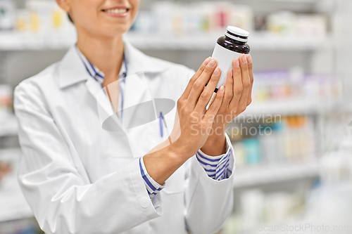 Image of close up of pharmacist with medicine at pharmacy