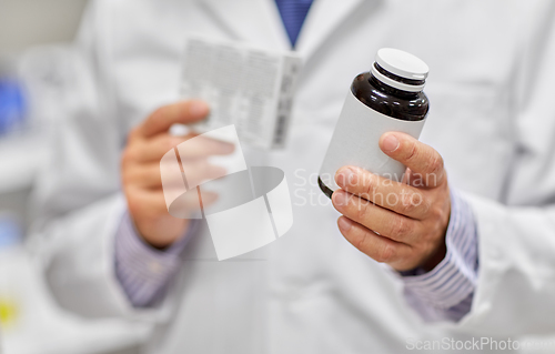 Image of close up of pharmacist with medicine at pharmacy