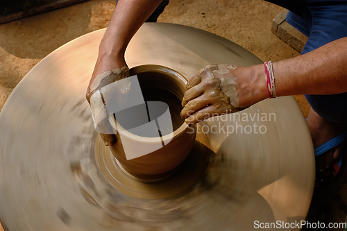 Image of Indian potter hands at work, Shilpagram, Udaipur, Rajasthan, India