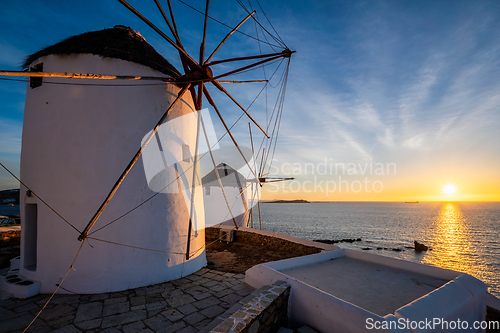 Image of Traditional greek windmills on Mykonos island at sunrise, Cyclades, Greece