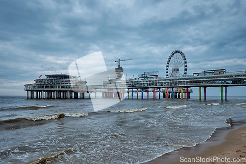 Image of The Scheveningen Pier Strandweg beach in The Hague with Ferris wheel. The Hague, Netherlands