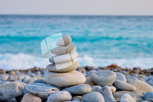 Image of Zen balanced stones stack on beach