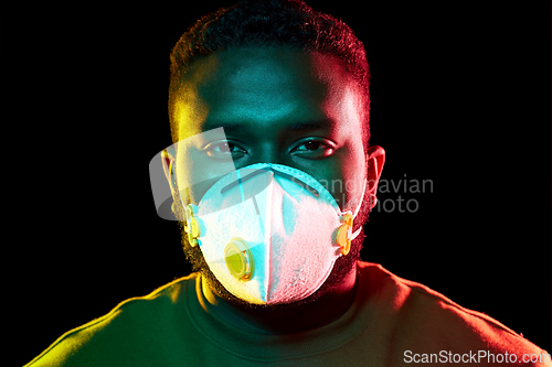 Image of african american man in mask or respirator