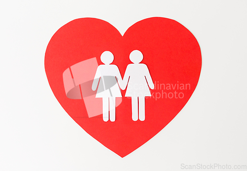 Image of paper cutout of female gay couple on red heart