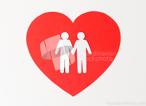 Image of paper cutout of male gay couple on red heart